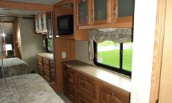 .immaculete 33ft cardinal 5th wheel trailer 3 pop outs great floor plan.rear liveing room.bathroom shower and sink seperat from toilet,door between bedroom area.mabe 200 miles on unit total.full winter package year round liveable.waranty can transfer and