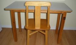 Solid hardwood chair and arborite table (wipes easily of crayon, paint, marker). Table frame and legs are pine.