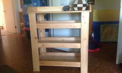 This handmade shelf can be used as a change table or a storage shelf. Perfect for people who are tall and find changing a baby on a standard change table hard on the back.