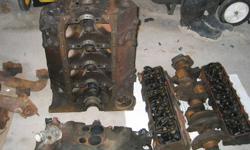 350 Chevy engine 4 bolt mains for rebuild , plus 350 turbo-hydramatic transmission and other related parts .
