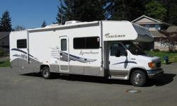 This 31', 2004 Class C Coachman, Leprechaun motor home with a V10 motor has only 52,000 miles on it. IN EXCELLENT CONDITION. Features include: double sink, microwave, refrigerator/freezer, 3-burner range, linoleum/carpet flooring; separate toilet, vanity