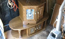 In great condition just too large for our small front room nice coffee table and end table with mirror doors it is brown in color I am in coombs