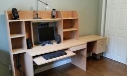 Near new computer desk as shown in photo. Can also be assembled in L configuration. New condition.