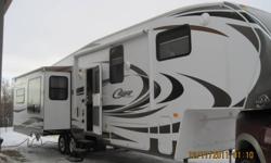 2011 Cougar 327RES Fifth Wheel, queen bed, island kitchen, separate bathroom, lots of storage, electric awning. Can be seen at RV Expert Home eastside of Hwy #2 opposite of Bowden or by calling  1-855-210-4858 Bob or Brad. Open 7 days per week 10am-6pm.