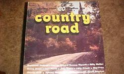 THIS VINYL RECORD ALBUM, COUNTRY ROAD, WAS RELEASED BY K-TEL INTERNATIONAL IN 1976. IT CONTAINS 20 ORIGINAL HITS BY 20 DIFFERENT COUNTRY AND WESTERN STARS OF THE TIME. ITS NUMBER IS WC-314. SOME OF THE FEATURED SONGS ARE: BEHIND CLOSED DOORS BY CHARLIE