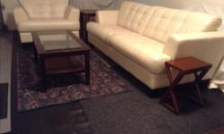 THIS CREAM COLOURED COUCH AND MATCHING CHAIR ARE LIGHTLY USED, VERY CLEAN AND IN EXCELLENT CONDITION. THE CHAIR IS 45" WIDE AND THE COUCH IS 88" LONG! THIS TOP QUALITY LEATHER PAIR IS IN A HOUSEHOLD OF NON-SMOKERS WITHOUT CHILDREN OR PETS! WE ARE