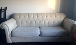 Very well kept cream coloerd upholstry couch. 2 seater, 42" width and 92" in leghnt. Minor scrathes on the couc legs. Text me with any questions at 306-580-0895