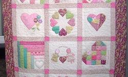 Custom made baby quilts.  You choose colors you would like based on your preference or nursery colors.  We will put together sample blocks to your quilt and email them to you for your approval.  You may approve them and if you disapprove, we will put