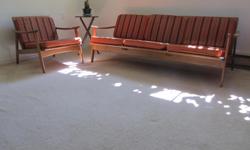 Quality hardwood couch and chair. Knockdown with original cushions all in good shape.