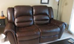 This couch was bought for an apartment and was only sat on twice..The apartment was then never rented...The couch has 2 recliners ( one for both seats).  It is like brand new.  The colour is a dark dark brown...Is perfect for any room in your home...Smoke