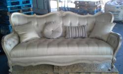 New sofa with damage to wood trim. It is repairable. this sofa retails for $3,600. Very nice! Pillows included.