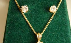 Diamond pendant with 18" chain - 14K - .26cts; and diamond stud earrings - 14K - .30cts tw. Have written appraisal from April, 2011 - set valued at $1450.00 before taxes. Worn only twice. Great gift for Christmas ;) Phone to negotiate price. 306-745-6350.