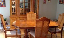 Solid dining room set. Includes 6 chairs, table with extension to seat 8 comfortably, china cabinet with inside lighting and 4 bottom cupboards for plenty of storage.