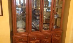Beautiful sculpted and inlaid dining room suite. Large table with extended leaf and seven chairs apolstered with peacock design for $1495. Matching hutch for $500.