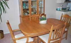 *Solid oak quality furniture
*Diningroom table with double pedestal base
*6 upholstered matching chairs including 2 captain's chairs
*3 extra leaves to easily accomodate 8-10 people
*Matching Buffet & Hutch 50"w x 19" deep x 78" h
*2 glass