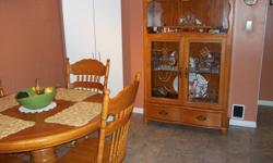 Round pedistal table and four chairs w/matching hutch.  Hutch is lighted.  A steal of a deal at 300.00 for everything.  Please email or call 780-760-2725.