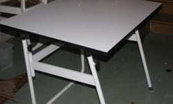 White solid drafting table....adjustable to change angles, folds to store...very sturdy and solid!!! Mint condition!!