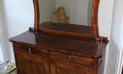 Older vintage solid wood dresser with beautiful wood framed mirror. 2 drawers and 2 cupboards with a shelf