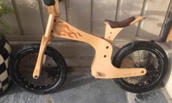 Excellent condition. Used by my daughter but now outgrown it. Rumoured to get a kid past training wheels, or skipping them, 2 years earlier!
Our flagship wooden bike. With it's slackened head tube, wide rear tyre, longer wheel base and low centre of