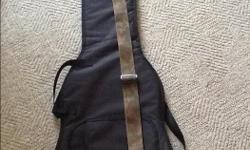 Great case for your electric bass. It is quite thin which will allow you to carry it with a backpack as well. Used to ride to school with. Little pocket on the front for a tuner and patch cord. Hard to beat. Comes with a Long and McQuade camo strap.