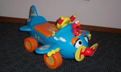 Ride On Airplane With a front propeller that spins and lights up, this Sesame StreetÂ® Fly with Elmo Airplane Ride-On from Tek NekÂ® features talking phrases. The stars on the vehicle body light up, while the plane's eyes move. Moving the gear shift on the