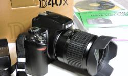 Selling an excellent Nikon D40x kit with its original accessories, including an 18-55mm lens, plus an 8GB SD card and a remote control in its original box. This is a couple of years old, has 18,350 shutter clicks - not a lot - is in excellent condition