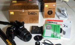 Selling a lovely and quite compact Nikon D40x kit with its original accessories, including an 18-55mm lens, plus an 8GB SD card and a remote control in its original box. This is a couple of years old, has 18,350 shutter clicks - not a lot - is in