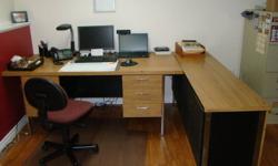 Executive desk and credenza in commercial grade oak laminate. Desk dimensions are 36" W x 72" L and the credenza is 18" W x 72" L. The desk has two file cabinets with three drawers on each end. They are both in good condition. Will include a free office