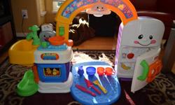 Fisher-Price Laugh and Learn 2-in-1 Kitchen with some accessories. It is fully functional with motion activated light walkway, volume controls, music, abc and talking functions. Call or email for more information and better pictures, email or 604-985-0078