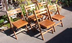 Five folding wood chairs. $5.00 each or $20.00 for all five.
