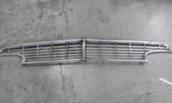 1956 Ford grill complete with center trim. Professionally straightened ready for chrome.