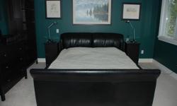 Hello. I have a California-King sized bed frame to give away for free. It was used with a waterbed mattress (and you can buy another one to use with this frame if you want) but you can also use it with a regular mattress.
The frame is black vinyl "sleigh