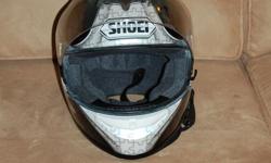 SHOEI Full face motorcycle helmet with visor. Size Medium. It was purchased in 2010 and only worn about 10 times. It has been stored in it's protected bag indoors ever since. Size Medium, DOT SNELL approved, Top of the line model. Always stored inside,