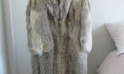 Full length fur coat - Wolf - made from winter pelts so its extra warm - impecible condition, my Mother moved down south, no longer needed. Rough measurements are: 16" arm (from arm pit to cuff) and 46" in total length
This coat was thousands of dollars