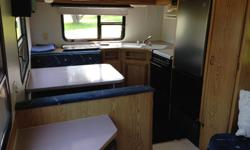 1993 27.5 foot travel trailer. New fridge 2 years ago. Gently used. Only owned by seniors. Sleeps 5-6 people. Two ice boxes, four burner stove, microwave, small deep freeze. Furnace and air conditioner. Wash room has tub, sink and shower. Can be seen at