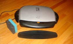 This is a George Foreman grill with grease catcher and cleaning sponge. $20