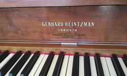 Beautiful Heintzman upright piano from ca. 1950's. Well maintained. A beautiful piece of furniture!