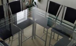 Dining room table 54x54 and 34' tall. Eight chairs, black microfibre. Hardly used, new condition.