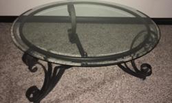 39" diameter round clear glass top coffee table with wrought iron legs.
Excellent condition
