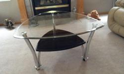 Like new, glass top coffee table with two matching end tables