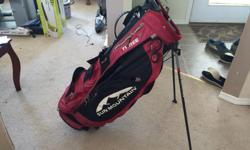 red and black sun mountain three 5 carry bag in good condition its a light bag. Has lots of pockets and a good umbrella holder on the side of the bag. i have rain cover it goes over the entire bag and keeps the bag dry good quality. 140 for golf bag and