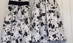 These are two gorgeous Bonnie Jean dresses that our granddaughters wore only a few hours as Flower Girls at a wedding. One in a size 6X and one in a size 4. The photos don't do them justice. The fabric has a lovely rich look to it. They are white with a