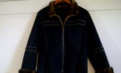 Beautiful jacket that is 2-in-1.   Black on one side and luscious brown faux fur on the other.  IMMACULATE mint condition- no damage, or signs of wear.  Paid almost $200, selling for only $50.