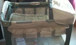 Grace Travel Crib with Landsend quilt set with bumper pad. The whole set is in excellent condition. Only used a couple times at Grandma's house. Crib and quilt set was $200+ brand new. This ad was posted with the Kijiji Classifieds app.