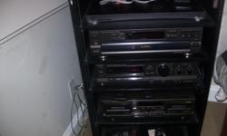 Technic Amplifier, 5 cd disc changer, 1 double casette players compact in a black cabinet