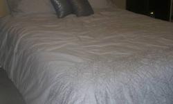 Grey Comforter, dust ruffle, pillow shams and two decorative pillows
Used a few times and then changed the color scheme and it no longer matches the room.