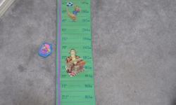 Winnie the Pooh growth chart with Velcro honey pot height marker.
New, unused