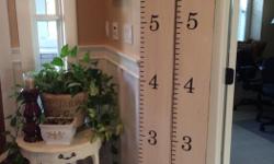 This wood growth chart is painted cottage white with distressing and measures 7"wide x 6' tall. the are priced at $40 each. One has the word "Family" at the top and one has a scroll detail. Different colored sharpies make these great for many kids. Great