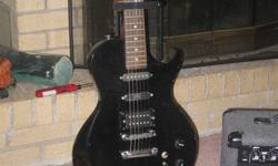 This guitar does not have a name on it.  It comes with a case that is in very good condition.  Amplifier is a Matrix. It also includes a guitar stand.
 
Great gift for Christmas