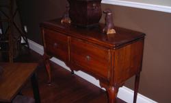 c 1928 entry table with storage. solid oak. has original finish and hardware. measures 42" l x 16" d x 30.5" h
